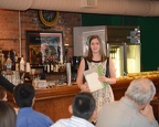 Colleen presenting alumni bumper stickers